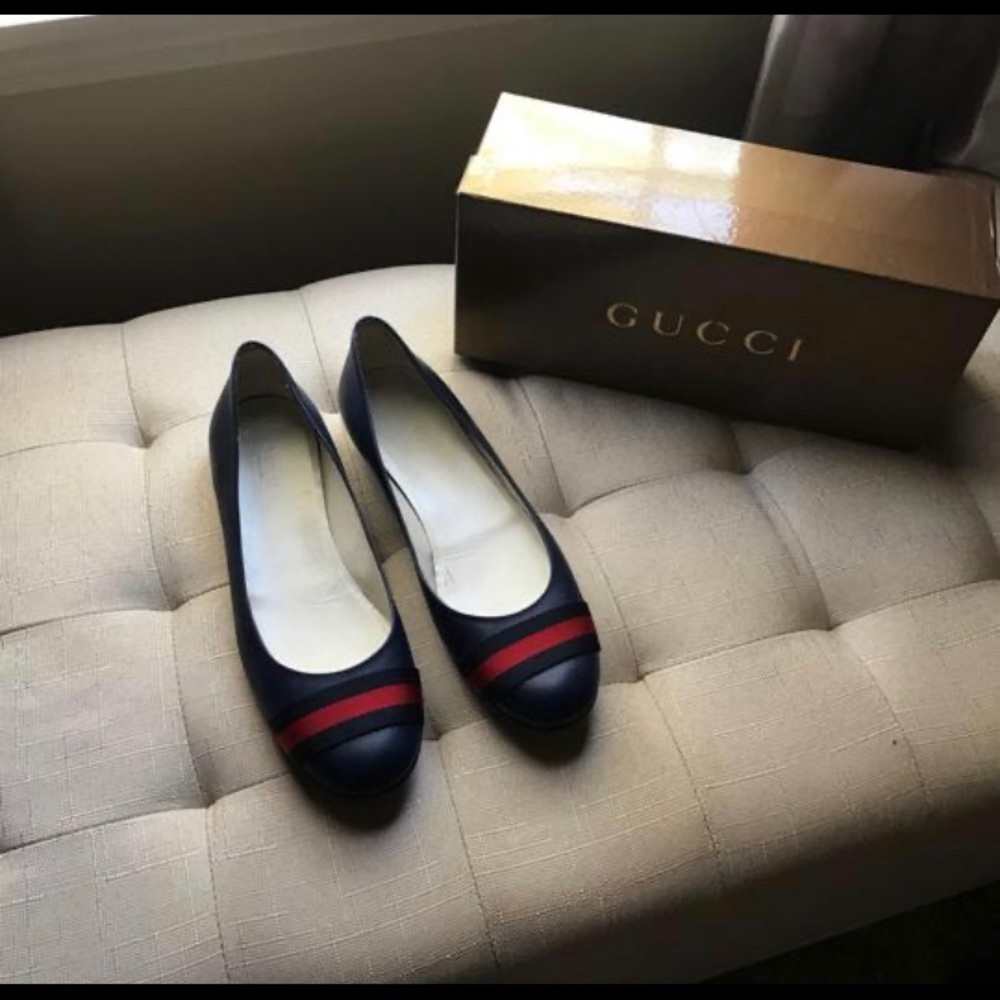 Navy blue Gucci ballerina shoes.